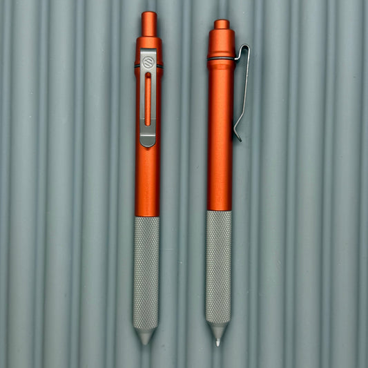 > Spoke Click Model C: Orange Lava Aluminum / Matte Titanium Peak Knurled Grip