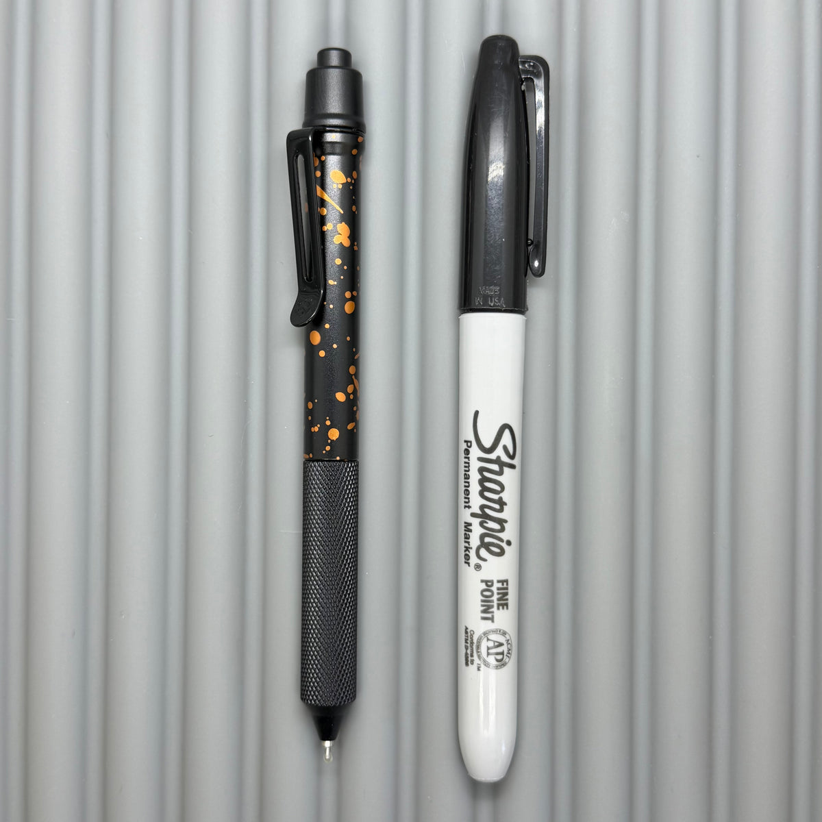 > Spoke Click Model C: Black with Orange Lava Splash, Aluminum / Black Aluminum Peak Knurled Grip