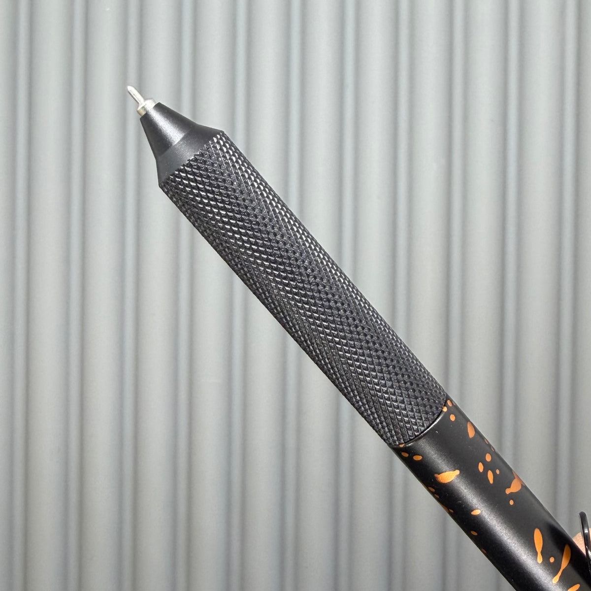 > Spoke Click Model C: Black with Orange Lava Splash, Aluminum / Black Aluminum Peak Knurled Grip