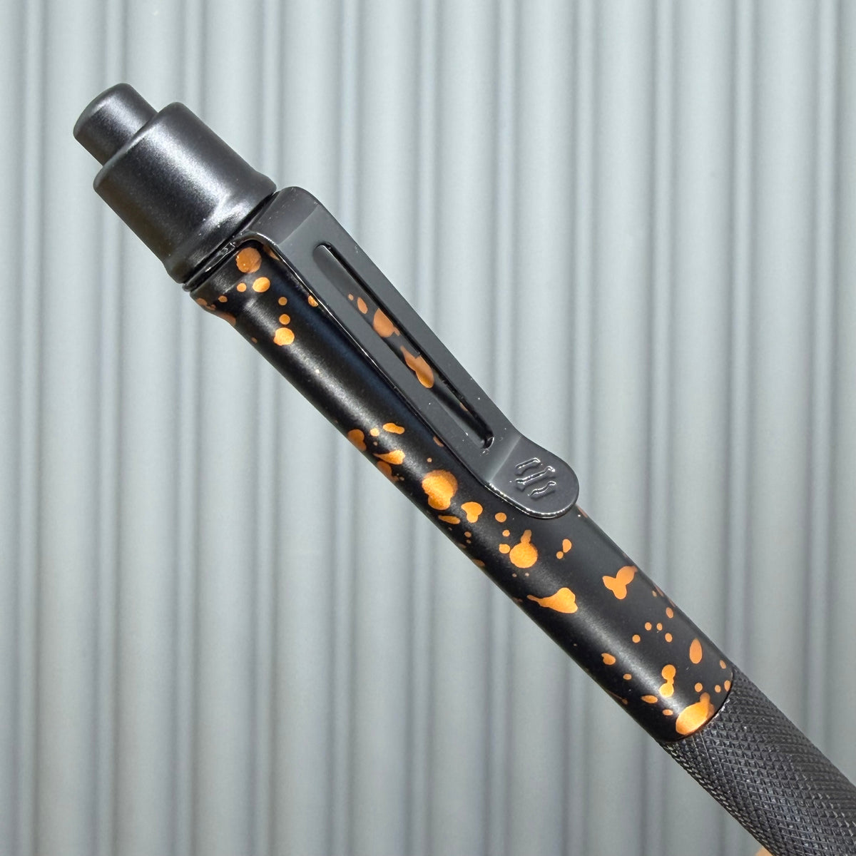 > Spoke Click Model C: Black with Orange Lava Splash, Aluminum / Black Aluminum Peak Knurled Grip