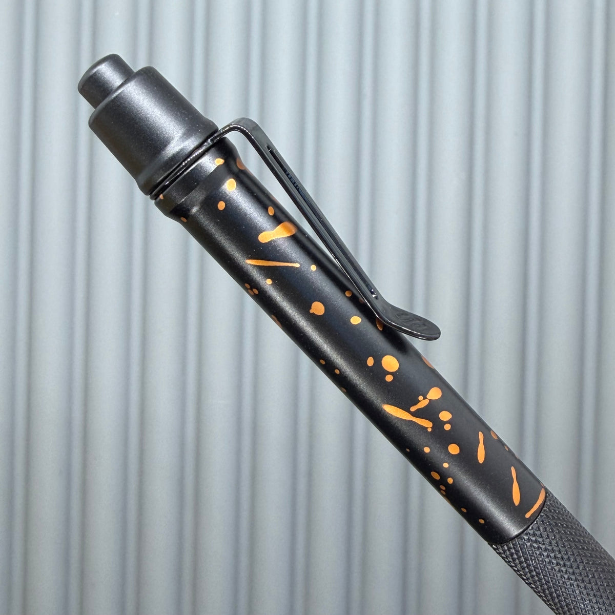> Spoke Click Model C: Black with Orange Lava Splash, Aluminum / Black Aluminum Peak Knurled Grip
