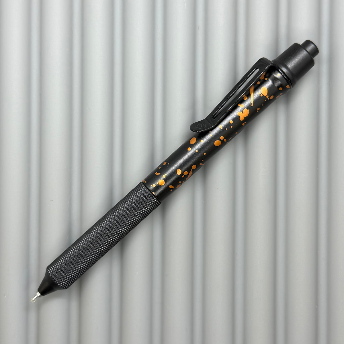 > Spoke Click Model C: Black with Orange Lava Splash, Aluminum / Black Aluminum Peak Knurled Grip