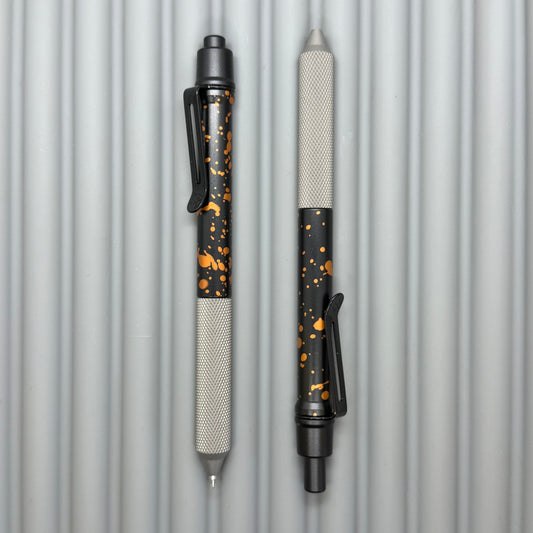 > Spoke Click Model C: Black with Orange Lava Splash, Aluminum / Matte Titanium Peak Knurled Grip