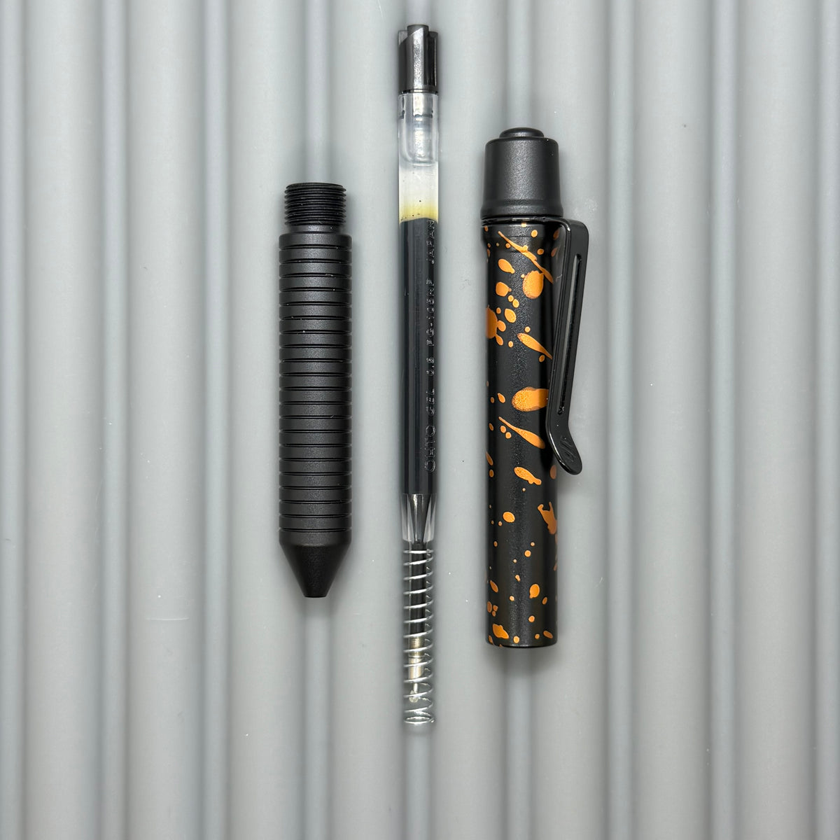> Spoke Click Model C: Black with Orange Lava Splash, Aluminum / Black Aluminum Grooved Grip